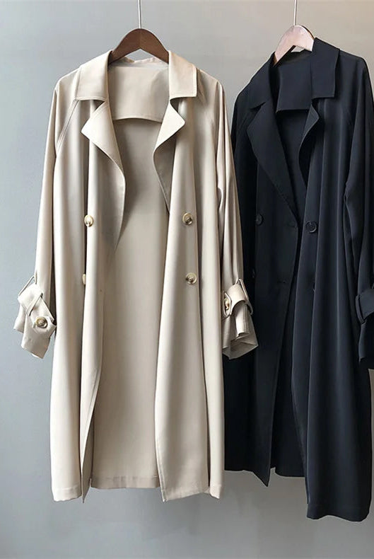 Elegant black women's trench coat with classic closure from Lumina Wear, featuring a tailored fit and stylish design.