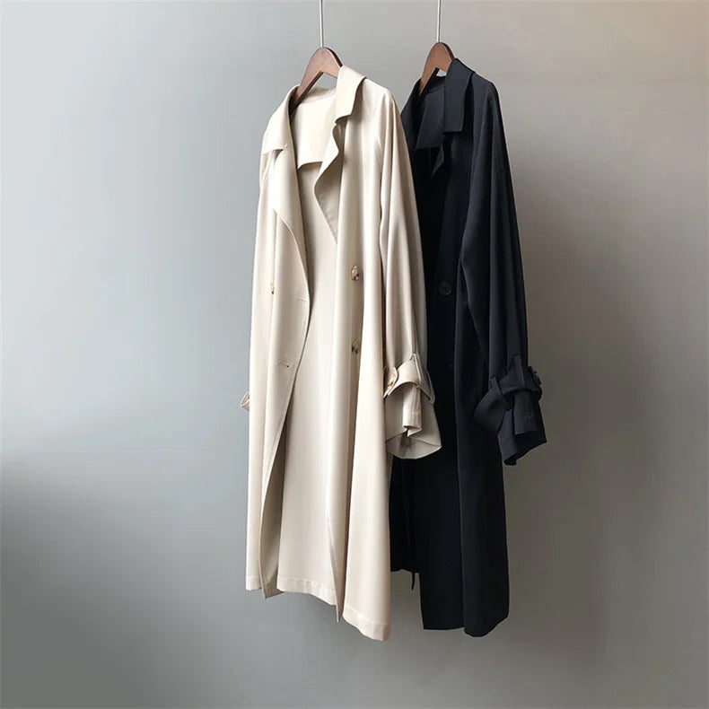 Black Valentina trench coat for women by Lumina Wear featuring a classic closure and elegant design.