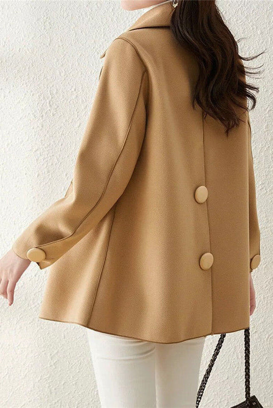 Elegant double-breasted wool coat with structured lapels from Lumina Wear's Valentina collection, shown in a stylish, tailored fit.