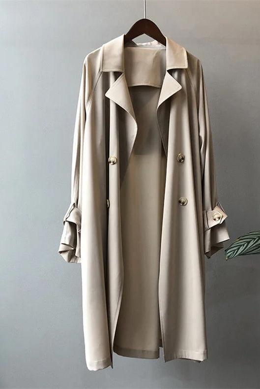 Elegant black lightweight trench coat with silky drape from Lumina Wear, designed for women, featuring a sleek, sophisticated silhouette.