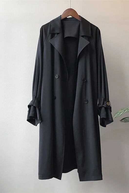 Elegant lightweight black trench coat for women with silky drape from Lumina Wear, showcasing a sleek, stylish design.