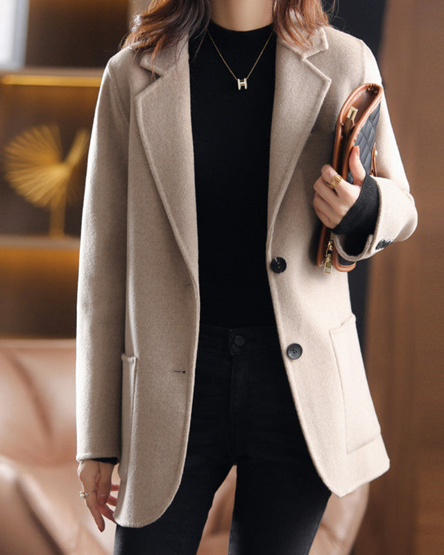 Lumina Wear Valentina wool coat with relaxed fit, lapel collar, and elegant design, styled for a sophisticated look.