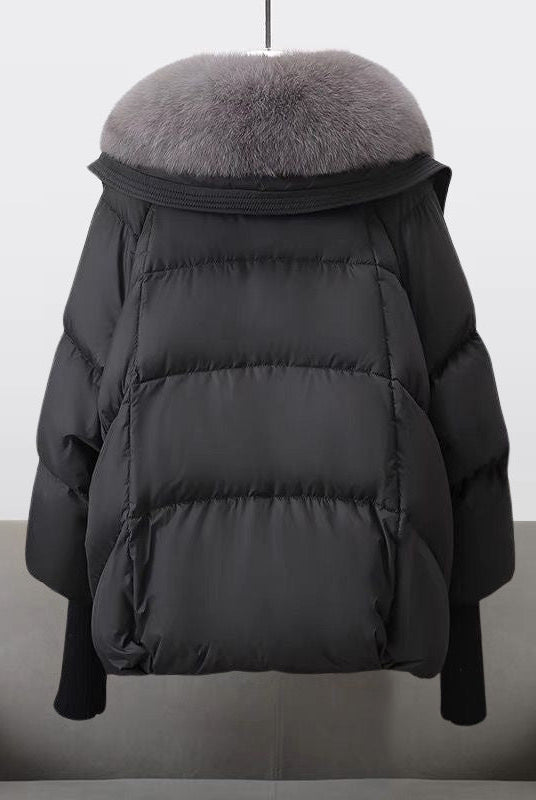 Extended-length black puffer jacket with fur collar by Lumina Wear, featuring a cozy, stylish winter puffer coat for women.
