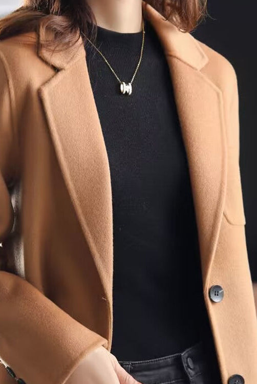 Valentina Lumina relaxed fit wool blend winter overcoat with lapel collar, shown in dark gray on a model.