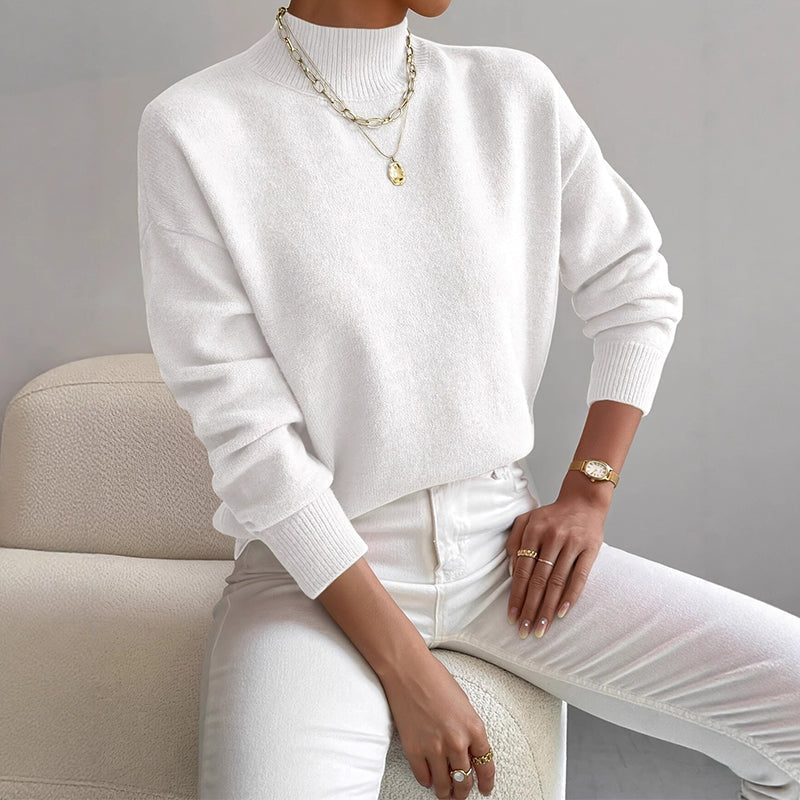 Lumina Wear Valentina relaxed mock neck knit sweater with ribbed cuffs, shown in a cozy, casual fit in a neutral color.