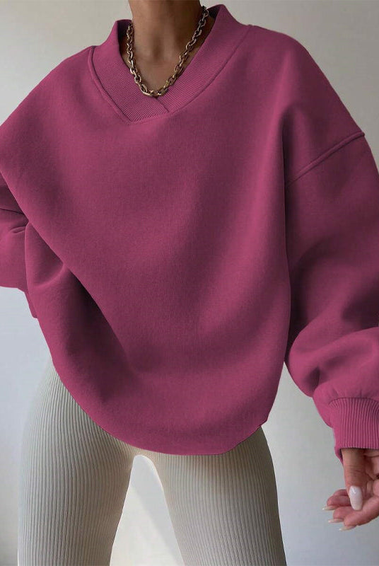 Light pastel oversized Lumina Wear Valentina sweater with a relaxed fit and V-neckline, displayed on a neutral background.