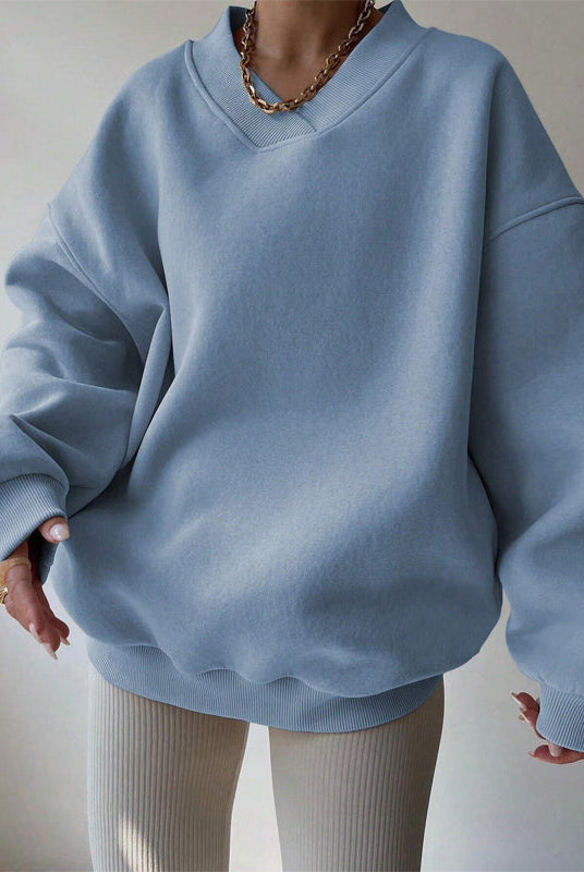 Lumina Wear Valentina pastel oversized sweater with relaxed fit and V-neckline, soft knit fabric, and long sleeves.