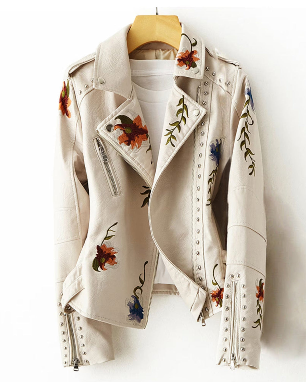 Valentina vegan leather jacket by Lumina Wear featuring retro floral embroidery and stud accents, stylishly displayed.