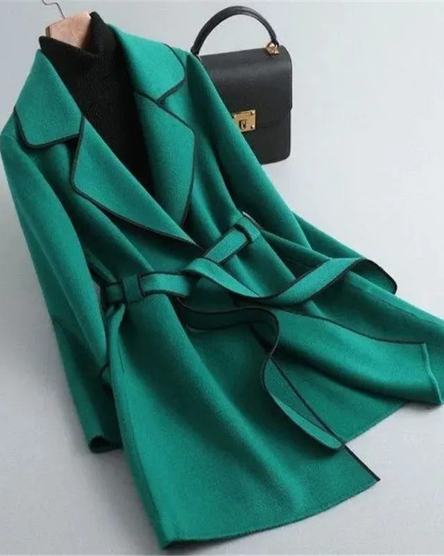 Elegant black trench coat with contrast piping from Lumina Wear, showcasing a tailored design and stylish details.