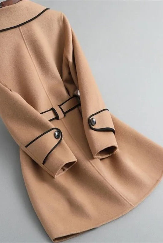 Black Verona trench coat with contrast piping by Lumina Wear, featuring a tailored fit and classic design with stylish details.