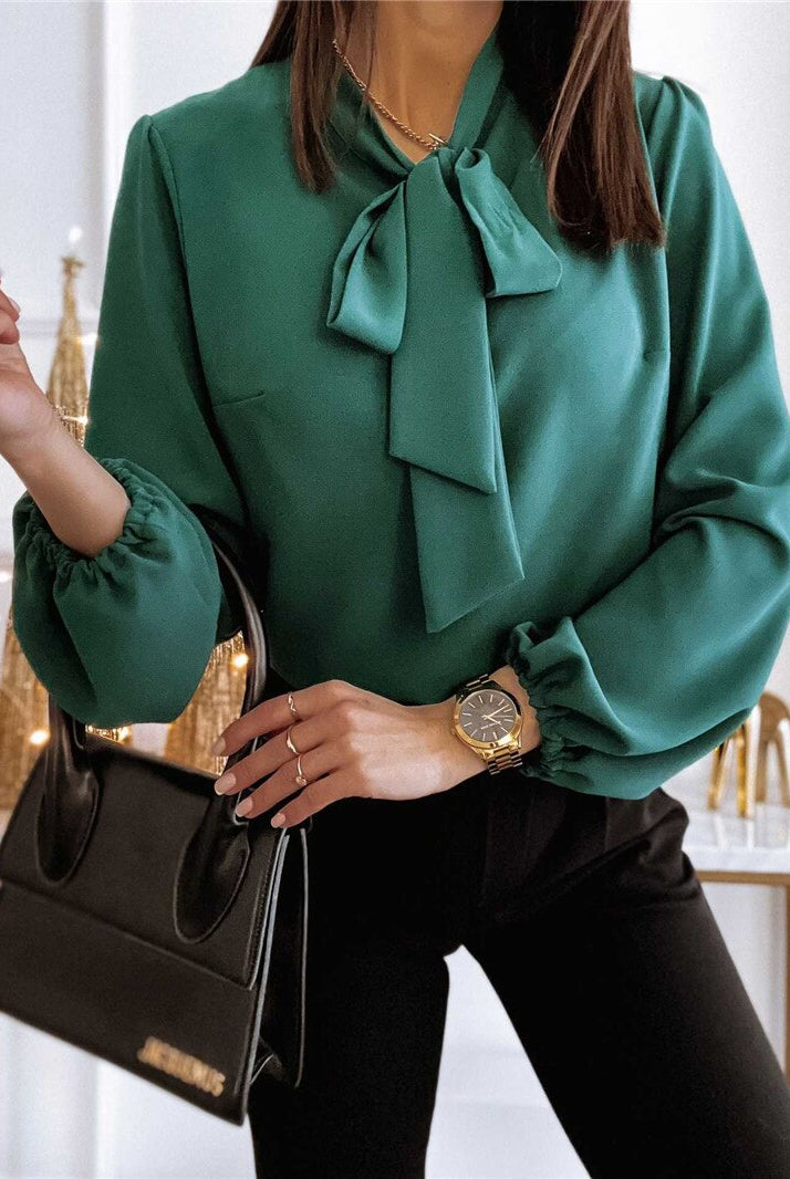 Lumina Wear Victoria women's blouse with elegant bow tie, puffed sleeves, and a classic design in soft fabric.