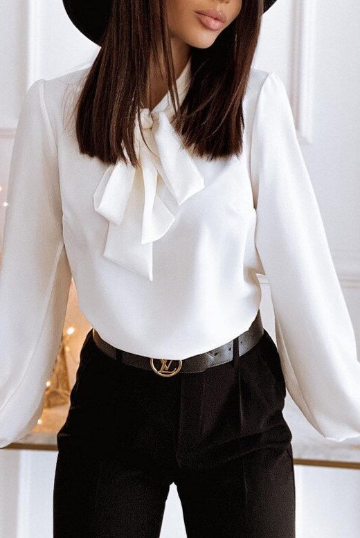Lumina Wear Victoria women's blouse featuring an elegant bow tie and puffed sleeves, stylish and sophisticated for fashionable wear.