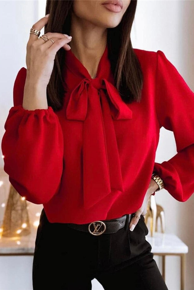 Victoria women's blouse by Lumina Wear featuring a bow tie design and puffed sleeves, shown in a stylish, elegant fit.