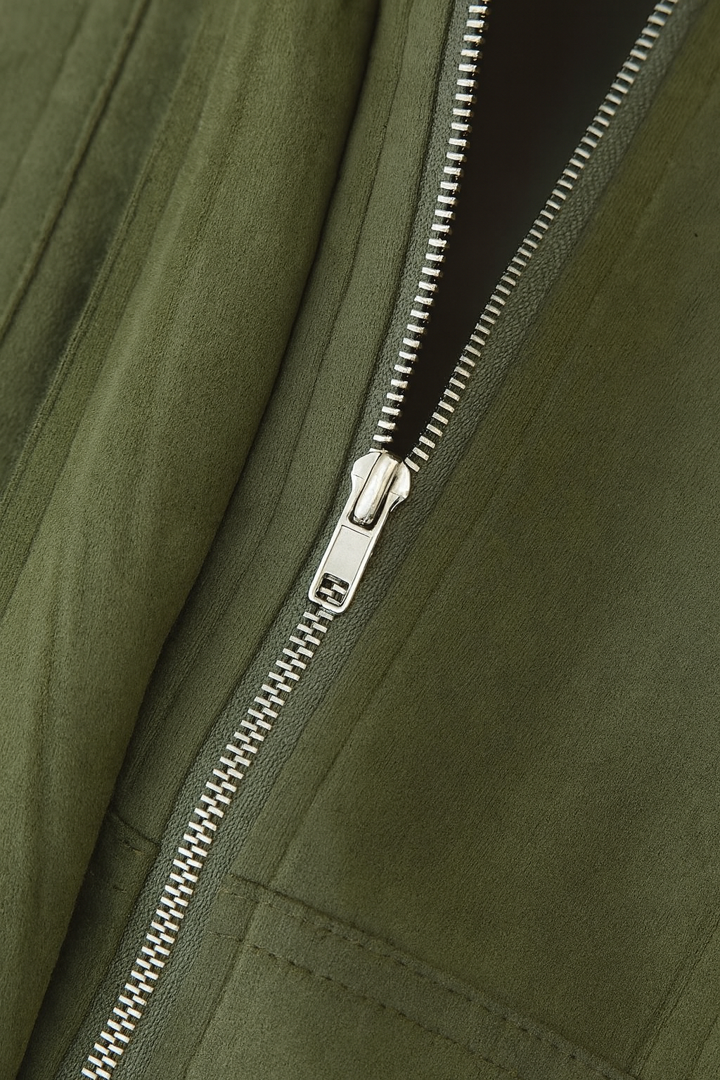 Green Lumina Wear Victoria bomber jacket with elegant design and timeless style, shown on a model.