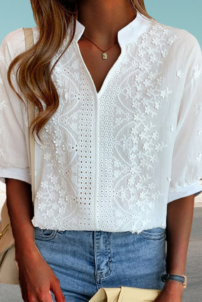 Light pink Victoria Lumina Wear puff sleeve blouse with V-neck, showcasing elegant design and soft fabric details.
