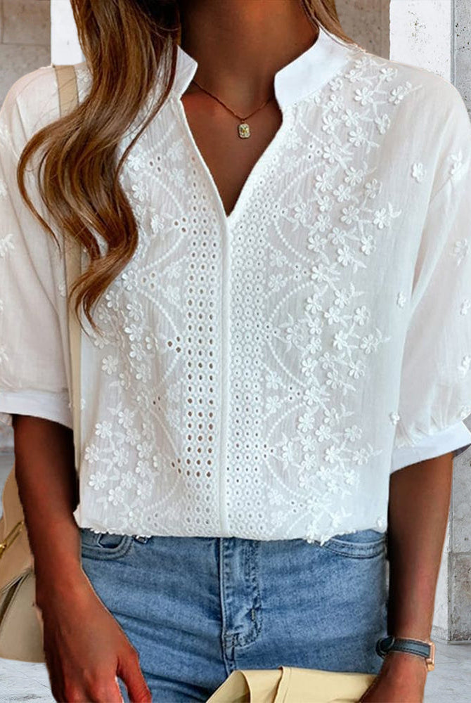 Victoria Lumina puff sleeve blouse with V-neck design, featuring elegant fabric and stylish detailing.