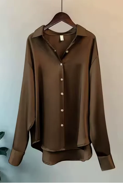 White button-down blouse with relaxed fit by Lumina Wear, featuring elegant design and classic collar for a sophisticated look.