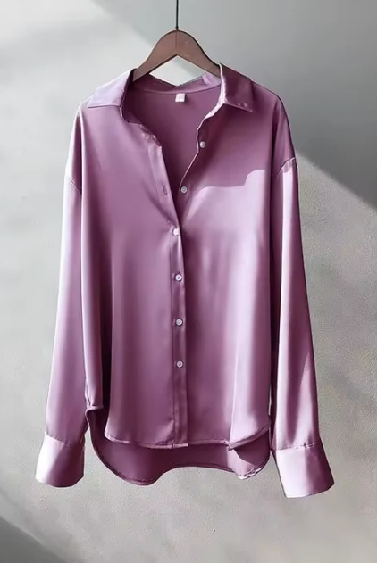 White button-down blouse with relaxed fit from Lumina Wear, styled on a model showcasing elegant, casual office-ready fashion.