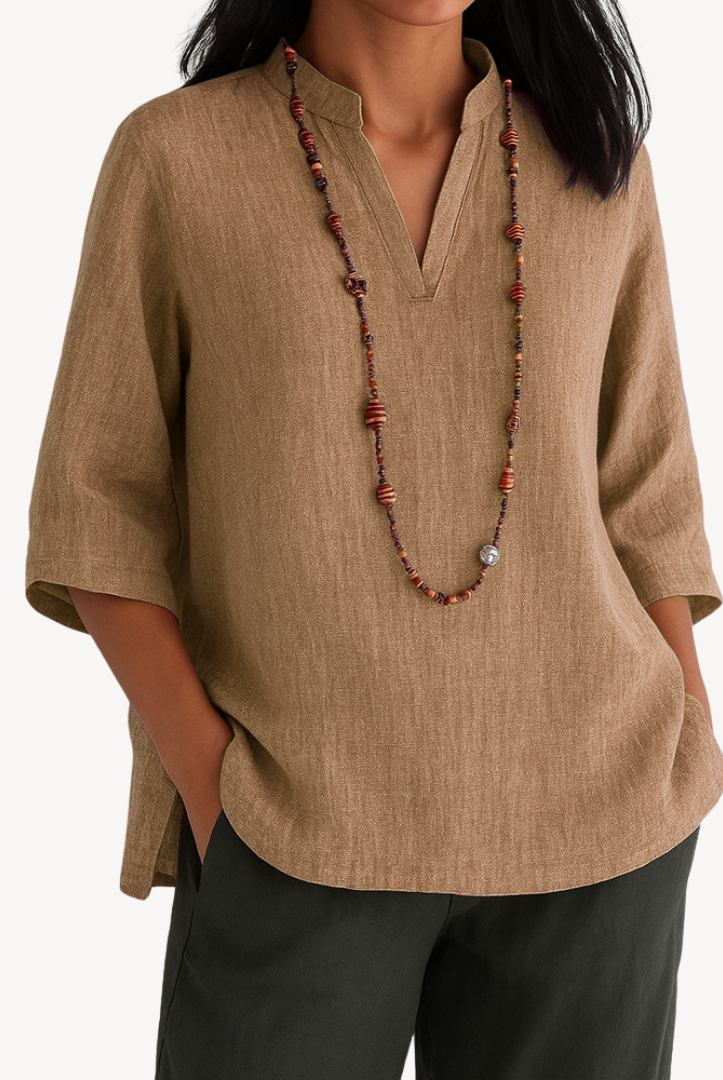 Light beige Victoria linen tunic top by Lumina Wear featuring a relaxed fit and minimalist design, shown on a model.
