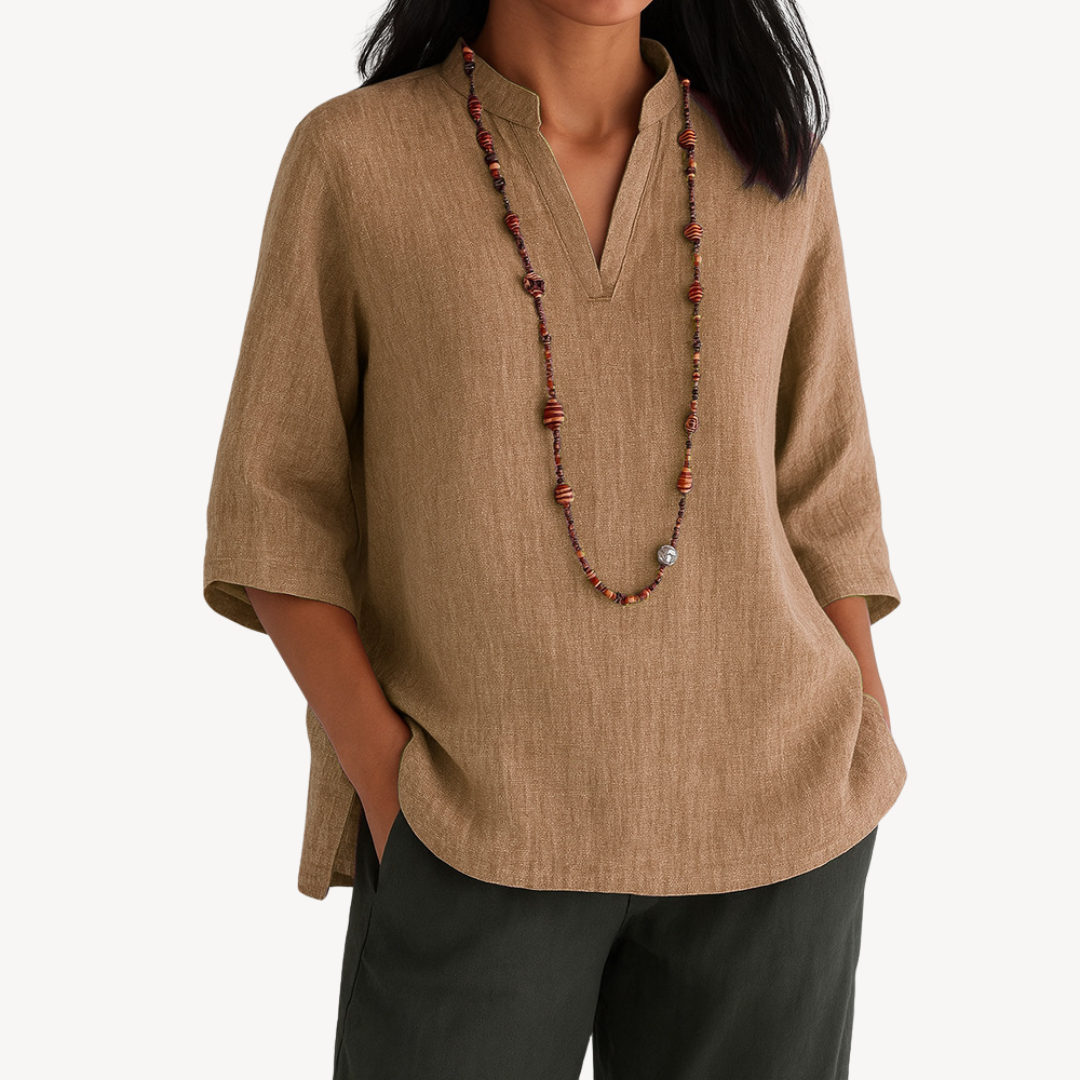Light beige Victoria linen tunic top by Lumina Wear featuring a relaxed fit and minimalist design, shown on a model.