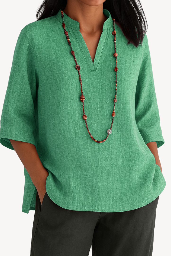 Victoria Lumina linen tunic top with minimalist design, relaxed fit, and lightweight fabric, ideal for casual wear.