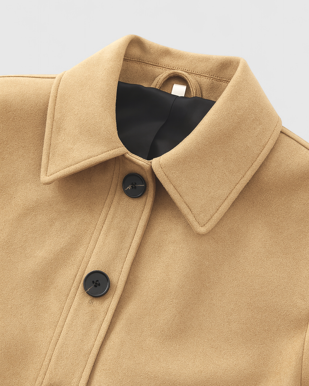 Victoria Lumina retro-inspired short jacket with button closure, featuring a stylish design and tailored fit.