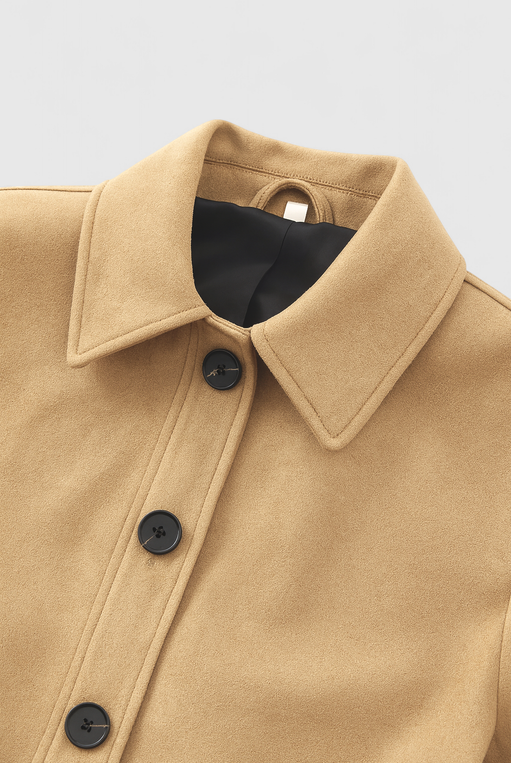 Victoria Lumina retro-inspired short jacket with button closure, featuring stylish design and lightweight fabric.