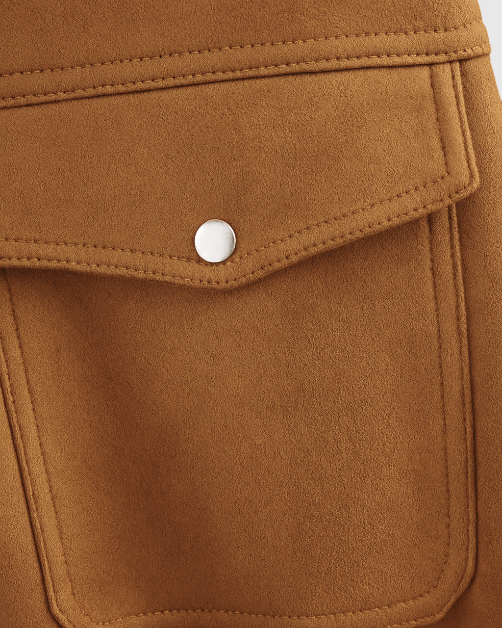 Trendy brown suede bomber jacket by Lumina Wear, featuring a stylish fit and timeless appeal, shown hanging on a wooden hanger.