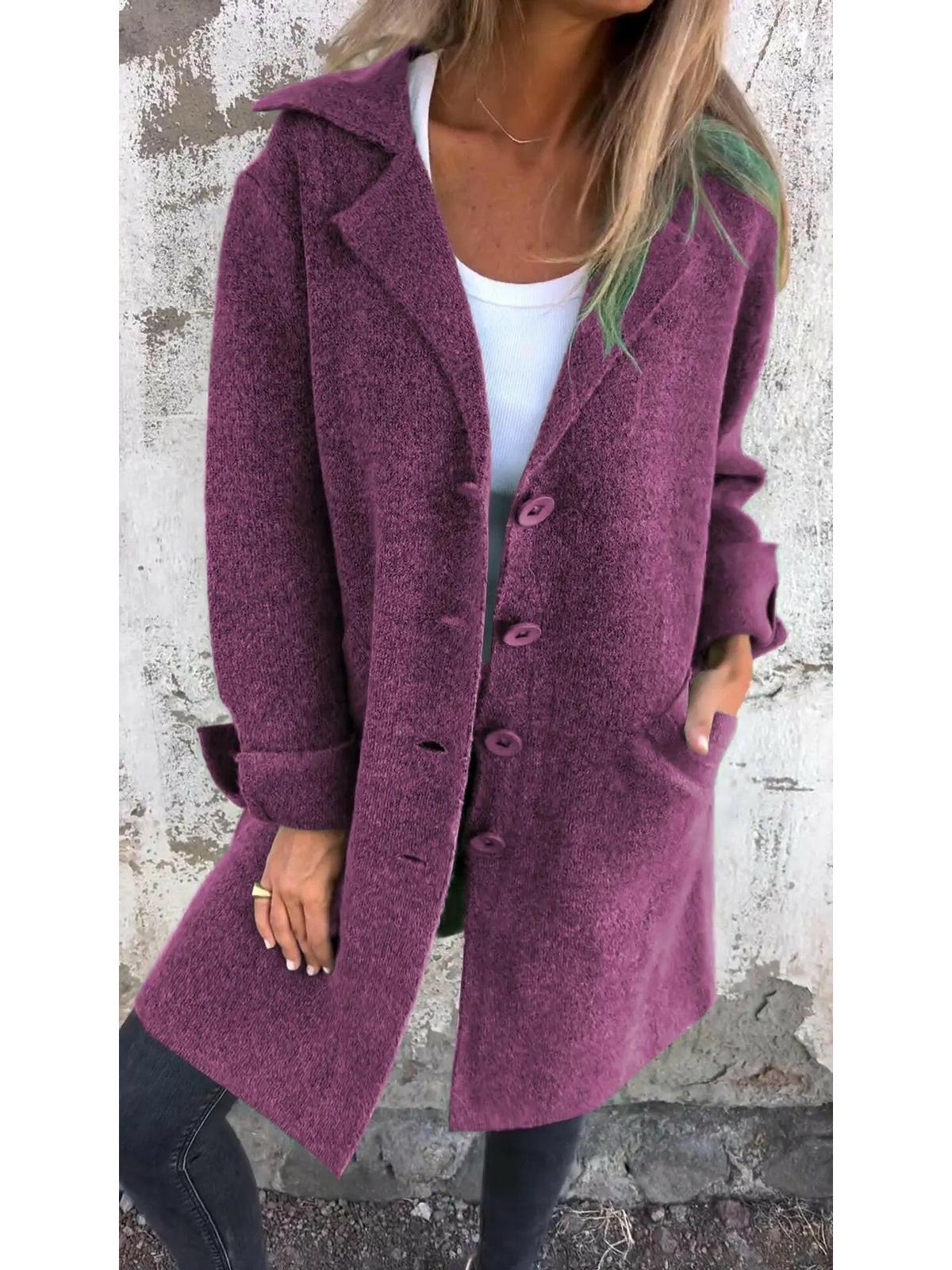 Green Ada™ long knit coat by Lumina Vancouver, stylish and cozy, shown hanging on a wooden hanger.