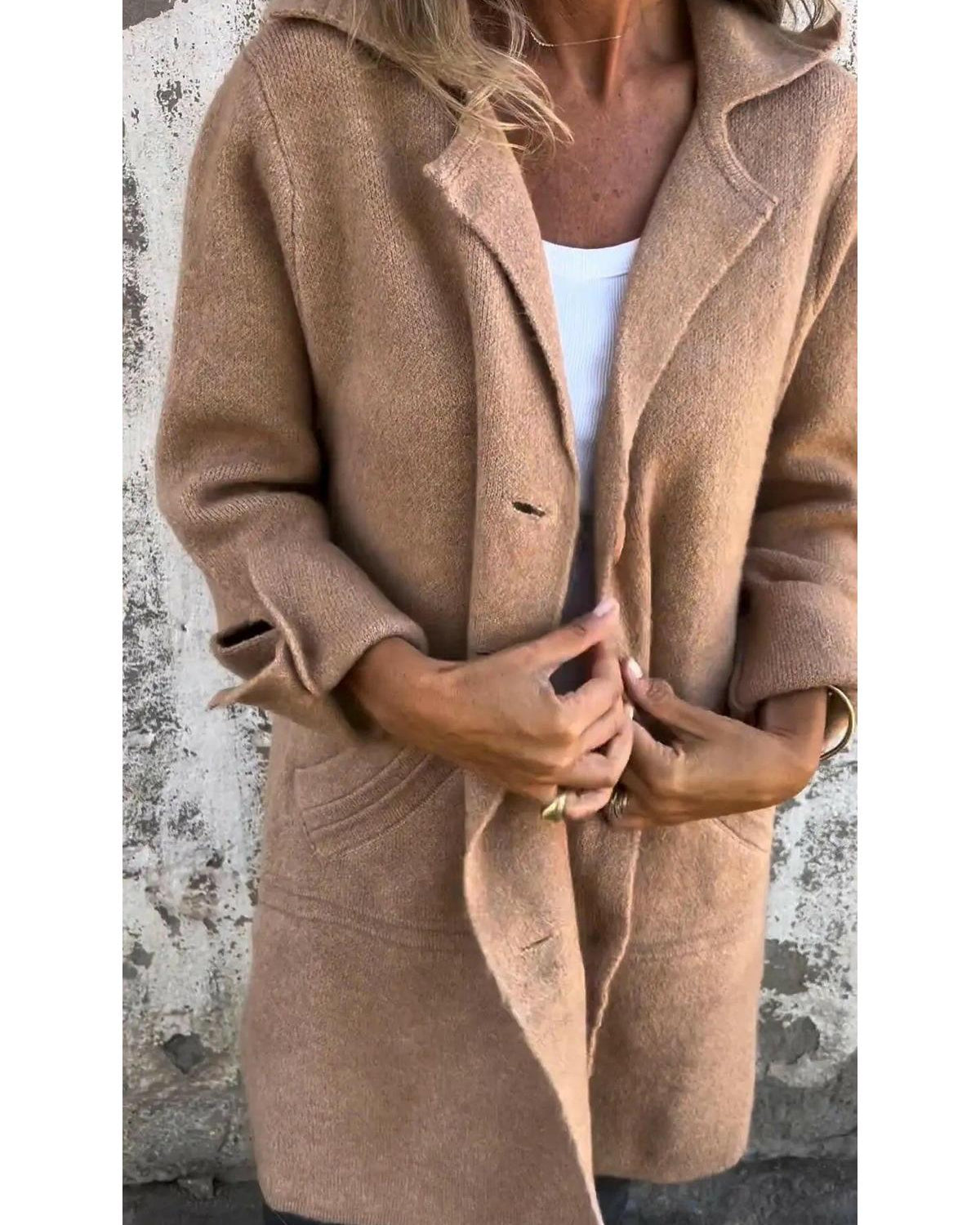 Green Lumina Wear Ada long knit coat displayed on a model, showcasing its stylish and cozy design.