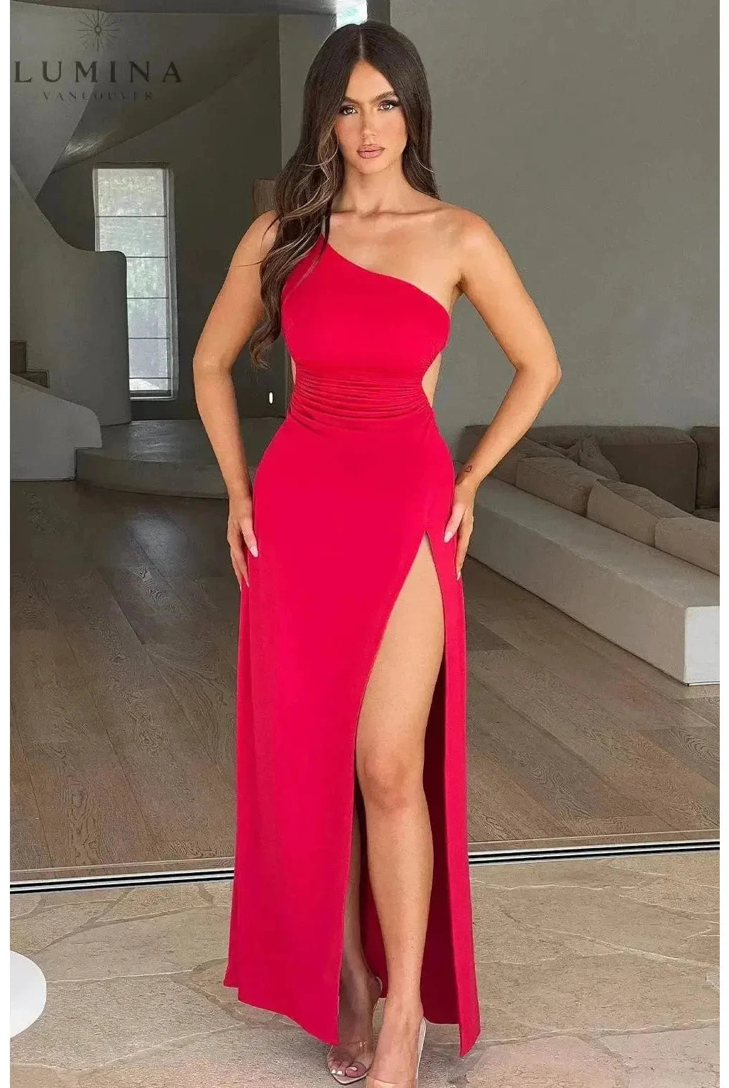 Red Adalyn maxi dress by Lumina Wear, elegant sleeveless gown suitable for wedding guests, shown on a model.