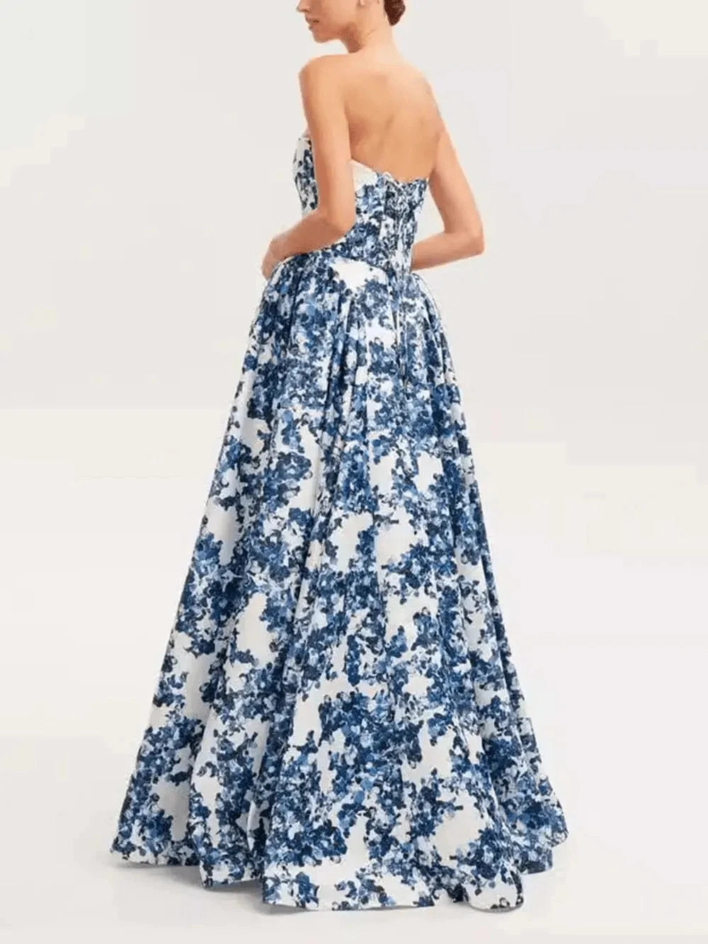 Blue Aitana floral gown by Lumina Vancouver, elegant wedding guest dress with intricate floral patterns and flowing fabric.