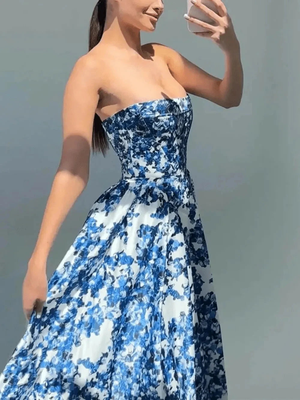 Blue Aitana floral gown by Lumina Vancouver, elegant wedding guest dress with intricate floral patterns and fitted silhouette.