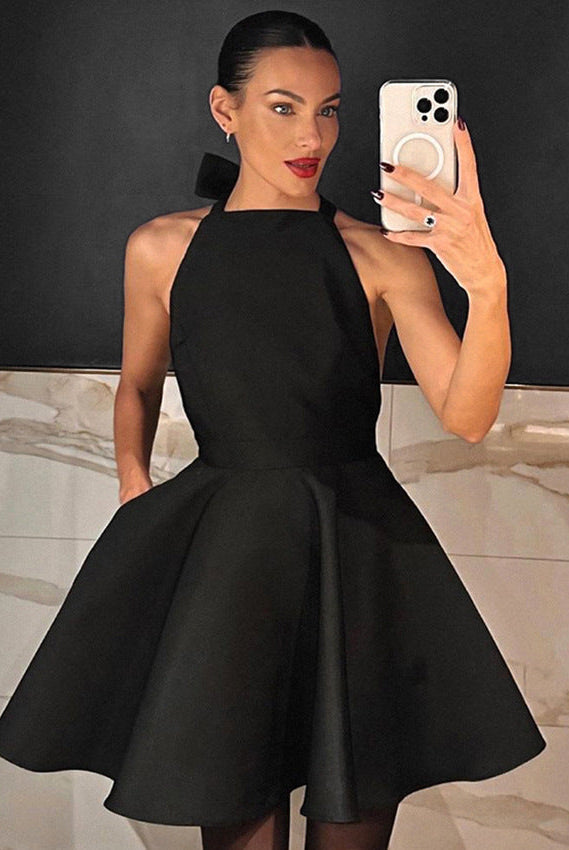 Black Alexandrine halter neck mini dress by Lumina Vancouver, stylish sleeveless dress with a fitted silhouette.