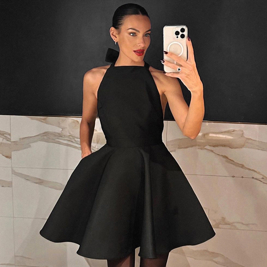 Black Alexandrine halter neck mini dress by Lumina Vancouver, stylish sleeveless dress with a fitted silhouette.