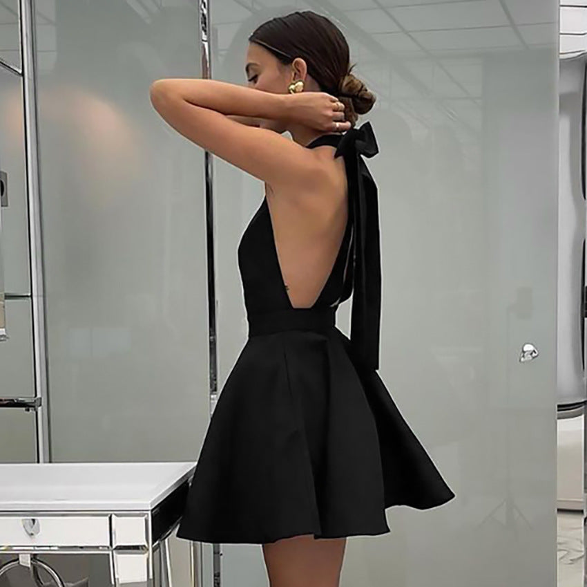 Black Alexandrine halter neck mini dress by Lumina Vancouver, featuring a stylish halter neckline and fitted silhouette.