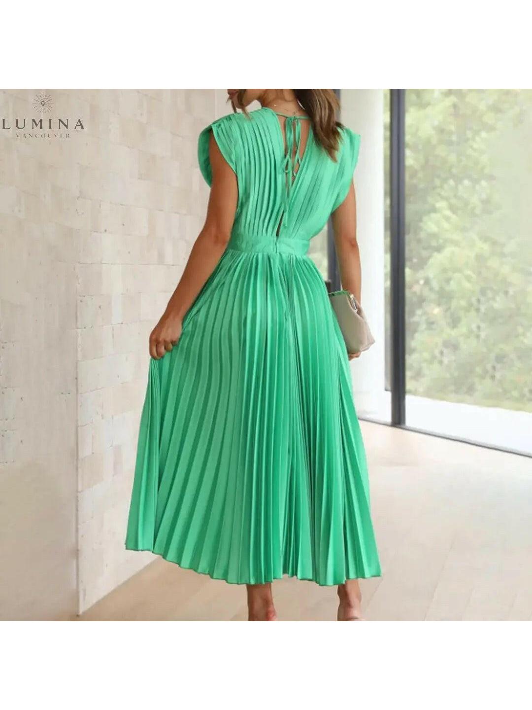 Alexia elegant champagne dress by Lumina Vancouver, perfect for wedding guests, featuring a stylish design and flattering fit.