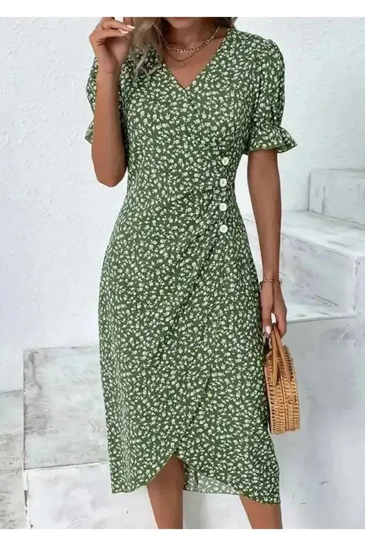 Green Alexxe modern chic floral dress by Lumina Vancouver, featuring a stylish design and tailored fit, displayed on a model.