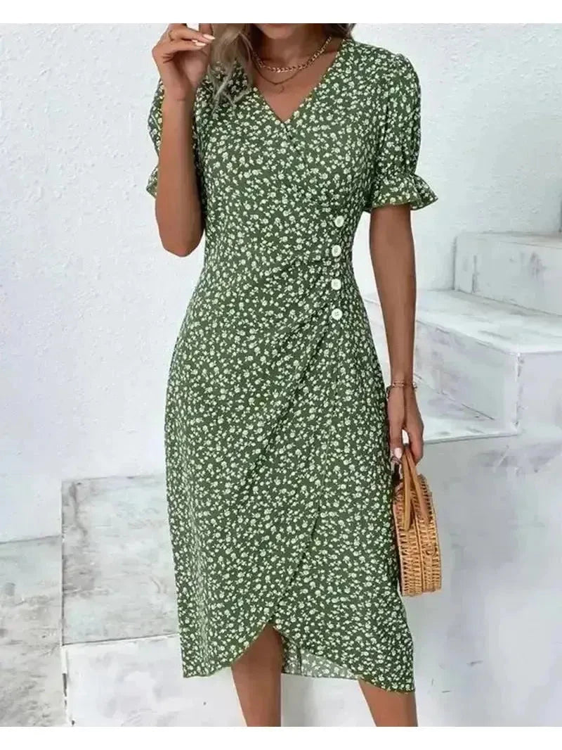 Green Alexxe modern chic floral dress by Lumina Vancouver, featuring a stylish design and tailored fit, displayed on a model.
