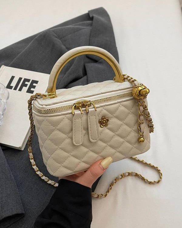 White quilted Lumina Wear Alice crossbody handbag with adjustable strap, stylish and compact for everyday use.