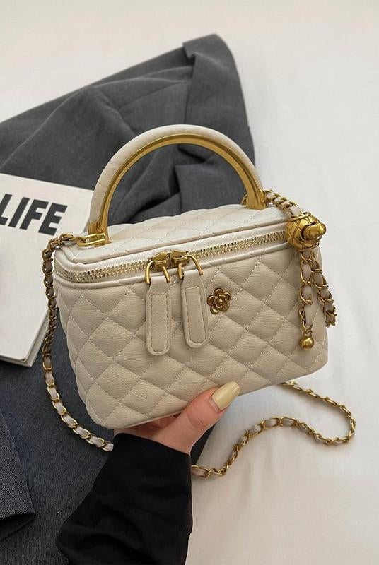 White quilted Lumina Wear Alice crossbody handbag with adjustable strap, stylish and compact for everyday use.