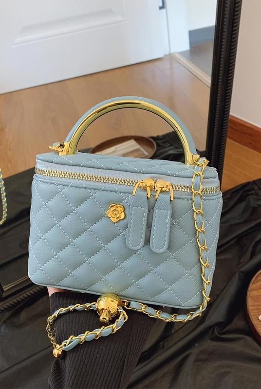 White quilted Lumina Wear Alice crossbody handbag with adjustable strap, stylish and compact for everyday use.