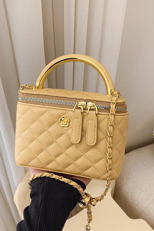 White quilted Lumina Wear Alice crossbody handbag with adjustable strap, stylish and compact for everyday use.