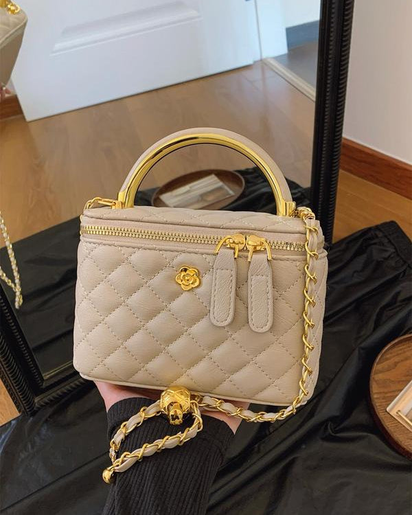 White quilted Lumina Wear Alice crossbody handbag with adjustable strap, stylish and compact for daily use.