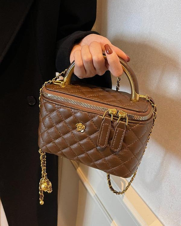 White Lumina Wear Alice quilted crossbody handbag with adjustable strap, stylish and compact for everyday use.