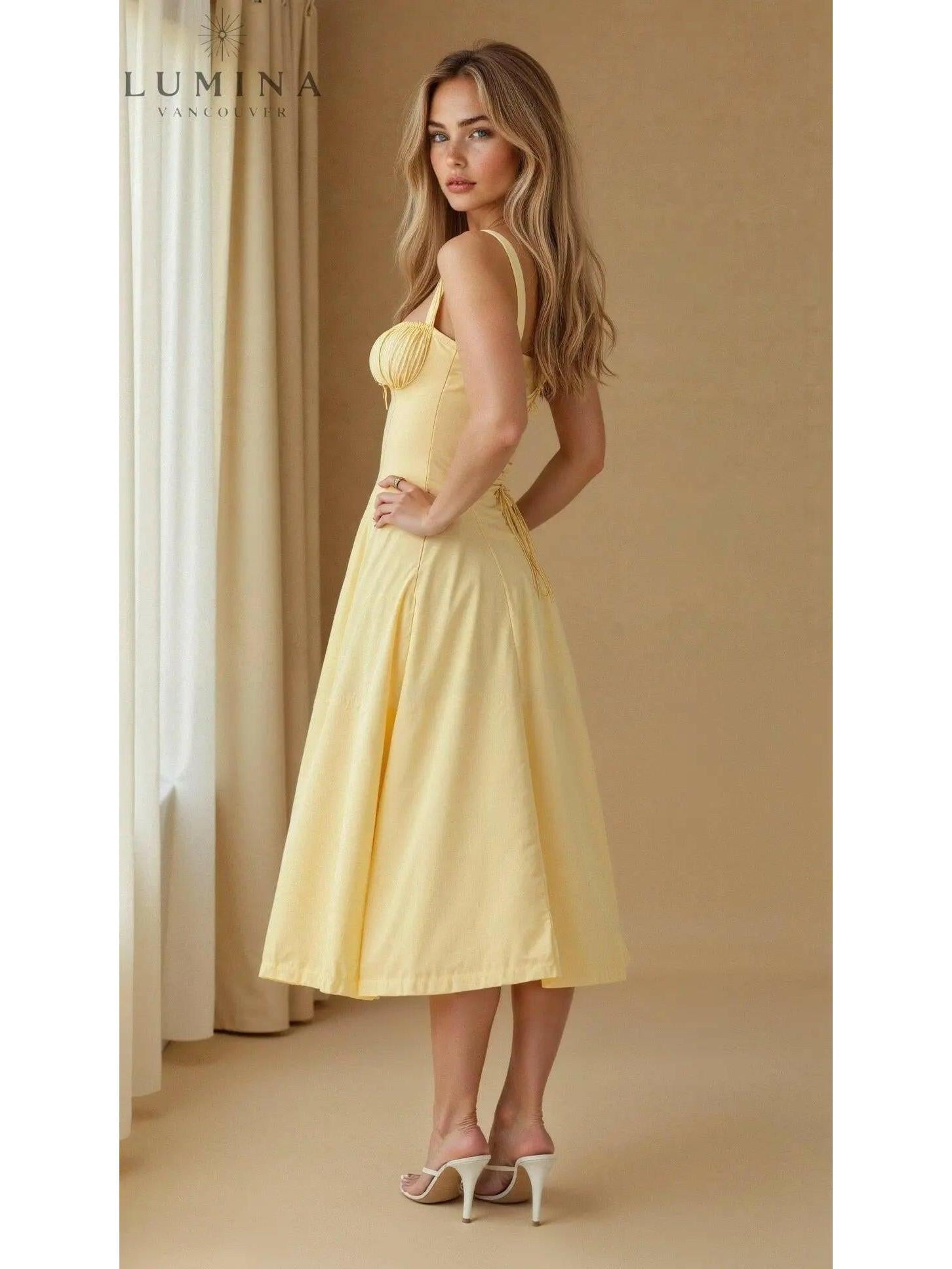 Yellow Alina waist dress by Lumina Vancouver, elegant and flattering wedding guest dress with chic style.