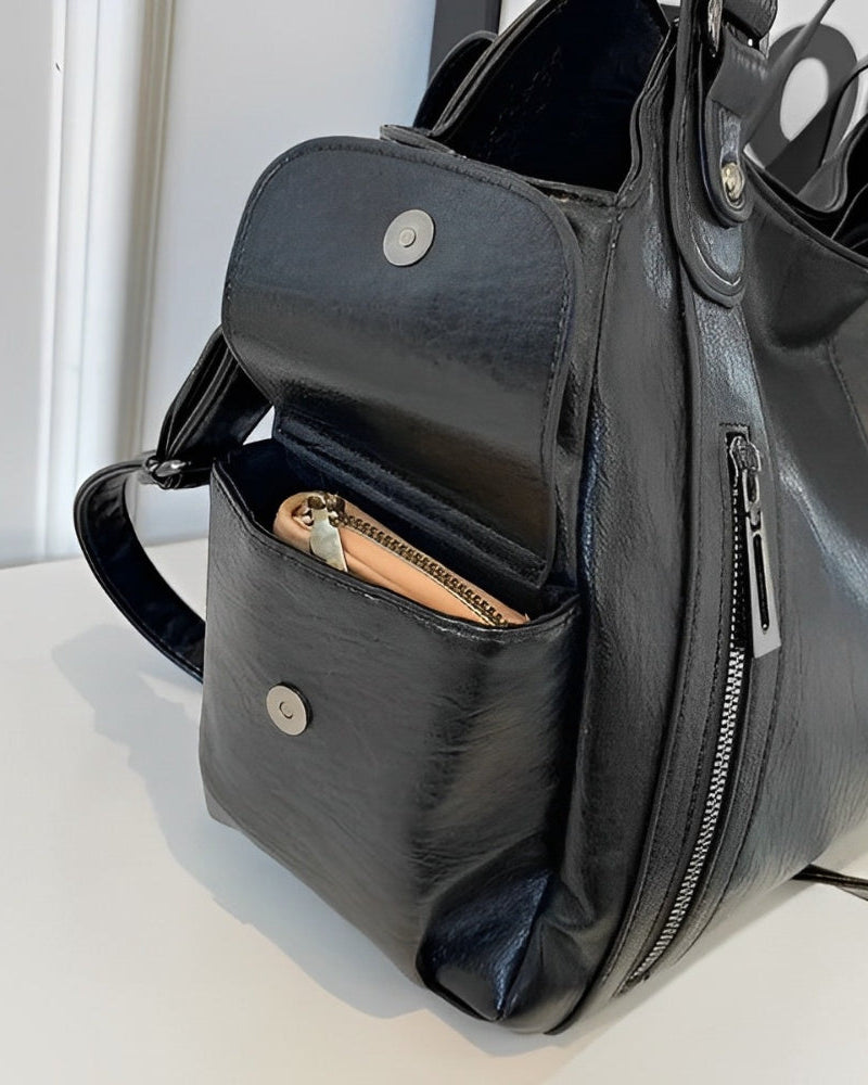 Lumina Wear Aliona black backpack featuring versatile design and stylish school bag appearance with multiple compartments.