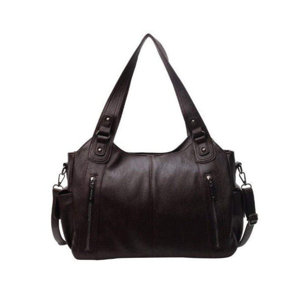 Black Lumina Wear Aliona backpack with multiple compartments and adjustable straps, stylish and versatile for school use.