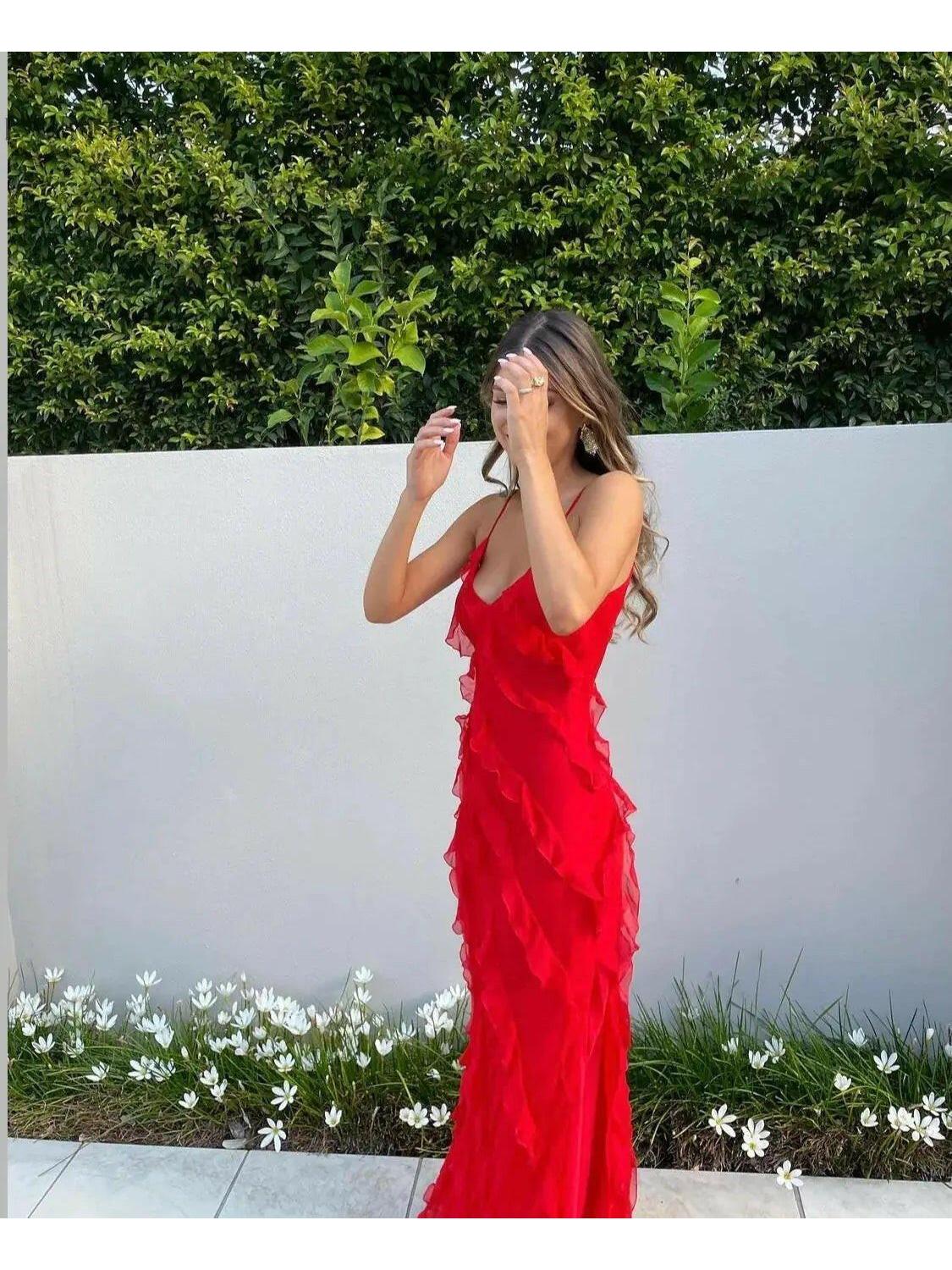 Red Aliza ruffled maxi dress by Lumina Vancouver, perfect for wedding guests, styled for elegant occasion wear.