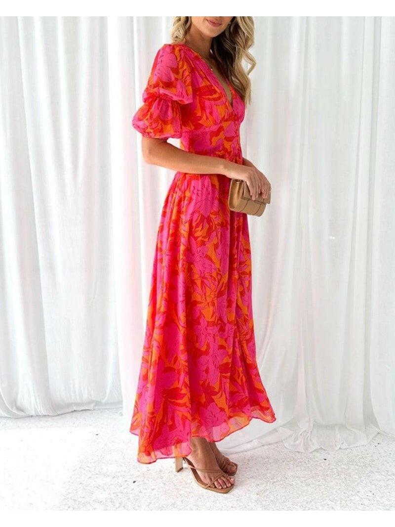 Red and pink Alva maxi dress by Lumina Vancouver featuring a V-neck and puff sleeves, elegant and flowing for formal occasions.